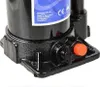 Close-up of the base of a hydraulic bottle jack, showing operational controls and a label. Náhled obrázku produktu