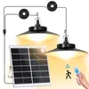 A solar panel and two hanging LED lights with a remote control. Anteprima dell’immagine prodotto