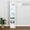 A tall, narrow white bookshelf filled with decorative items and books, placed against a light gray wall. Produktbild-Vorschau