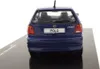 The rear view of a blue Volkswagen Polo model car on a black display base. Produktbild-Vorschau