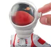 Close-up of a Barbie astronaut doll's helmet, showing a miniature planet and stars inside. Produktbild-Vorschau