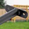 Close-up of a black metal bar with mounting brackets, set against a blurred outdoor background of grass and playground equipment. Produktbild-Vorschau