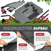 An image showing the assembly steps for a dog bed with a roof, set on grass. Produktbild-Vorschau
