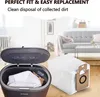 A vacuum cleaner dustbin and replacement dust bags are shown in a living room setting with a sofa and coffee table in the background. Produktbild-Vorschau
