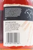 A close-up of a label on a bottle of rum, showing tasting notes and a barcode. Produktbild-Vorschau