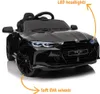 A black electric BMW M4 Competition toy car for children, shown from the front with orange arrows pointing to its features. Anteprima dell’immagine prodotto