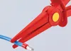 A close-up shot of red pliers holding a blue wire with a silver connector. Anteprima dell’immagine prodotto