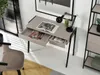 A modern desk setup with a desk, chair, lamp, and books. Anteprima dell’immagine prodotto