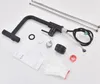 A black kitchen faucet and its accessories are laid out on a white background. Náhled obrázku produktu