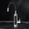 A modern kitchen faucet with a digital display is shown against a dark, textured background, with a reflective, watery surface in the foreground. Náhled obrázku produktu