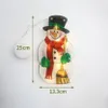 Leuchtende Schneemann-Dekoration mit schwarzem Zylinder, rotem Schal, grünen Handschuhen und einem Besen, mit Maßen Productafbeelding-voorbeeld