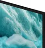 A close-up view of a television screen displaying a textured, abstract image with shades of blue and white. Produktbild-Vorschau
