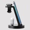 A black 3-in-1 wireless charging stand holding an iPhone, Apple Watch, and AirPods. Produktbild-Vorschau