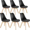 A set of six black dining chairs with wooden legs arranged in two rows. Náhled obrázku produktu