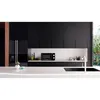 A modern, minimalist kitchen with black cabinets and a white countertop. Anteprima dell’immagine prodotto