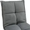 A close-up view of a dark gray upholstered floor chair. Voir les images du produit