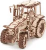A wooden model tractor on a white background. Náhled obrázku produktu