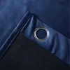 A close-up view of a blue curtain with a metal grommet and a dark lining. Produktbild-Vorschau