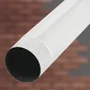 A close-up of a white metal pipe against a brick background. Náhled obrázku produktu