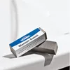 Two cleaning erasers are placed on a white surface, with one partially covered by a product box. Produktbild-Vorschau