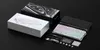 A product shot of a mechanical keyboard and its accessories, laid out on a black surface. Produktbild-Vorschau