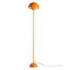 An orange floor lamp with a dome-shaped shade and a round base, standing on a white background. Podgląd zdjęcia produktu