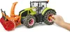 A toy tractor with a snow blower attachment and snow chains on the tires, being held by a child's hand. Anteprima dell’immagine prodotto