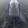 A close-up, angled view of a clear plastic shower door seal with purple accents, resting on a dark, tiled floor. Produktbild-Vorschau