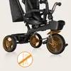 Close-up view of a black tricycle with orange highlights and icons indicating features. Produktbild-Vorschau