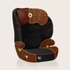 A studio shot of a black and brown car seat against a light beige background. Produktbild-Vorschau