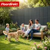 A family and their dog enjoying a sunny day in a garden, with a privacy fence in the background. Produktbild-Vorschau