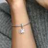 A close-up shot of a person's arm wearing a silver Pandora bracelet with a clover and moon charm. Produktbild-Vorschau