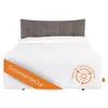 A bed with a headboard and a white duvet or blanket. Produktbild-Vorschau