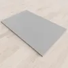 A grey shower tray on a light wood floor. Produktbild-Vorschau