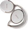 A pair of white and silver Denon headphones are folded and displayed against a white background. Produktbild-Vorschau