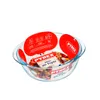 A clear glass bowl with food inside, placed on a white background. Anteprima dell’immagine prodotto