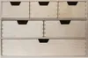 A front view of a wooden drawer unit with six drawers. Produktbild-Vorschau