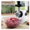 A white Bosch meat grinder is shown in a kitchen setting, with a bowl of ground meat in the foreground. Podgląd zdjęcia produktu