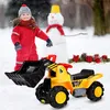 A child in a red snowsuit stands next to a yellow toy digger in the snow, with a snowman in the background. Anteprima dell’immagine prodotto