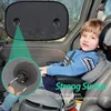 A child sits in a car seat, with a sunshade visible in the background. Produktbild-Vorschau