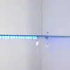 A close-up view of a white cabinet corner with a glass shelf and blue LED lighting. Produktbild-Vorschau