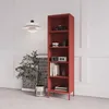 A tall red bookshelf is displayed in a room with white paneled walls and a gray floor. A pendant light hangs from the ceiling, and a potted plant with a large abstract print sits next to the bookshelf. Náhľad obrázku produktu