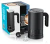 A black electric milk frother and its packaging are displayed on a white surface. Náhled obrázku produktu