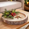 A wooden tray decorated with pine branches, pinecones, red berries, and cinnamon sticks, placed on a wooden table. Náhľad obrázku produktu