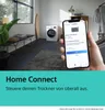 A hand holding a smartphone displaying a laundry app, with a washing machine in the background. Produktbild-Vorschau