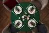 A festive Christmas table setting with plates, cutlery, napkins, and decorations. Produktbild-Vorschau