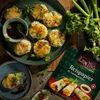 A spread of spring rolls and dipping sauce, with a package of rice paper and fresh ingredients. Anteprima dell’immagine prodotto