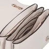 A close-up view of the interior compartments of a white handbag. Produktbild-Vorschau