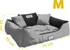 A dog bed with dimensions indicated by measurement lines. Voir les images du produit
