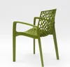 A green plastic chair with an open, web-like backrest is shown from a side-rear angle against a white background. Voir les images du produit